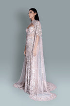 Gown with a dramatic cape and intricate embroidery in a beautiful pattern - Side