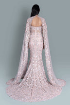 Gown with a dramatic cape and intricate embroidery in a beautiful pattern - Back