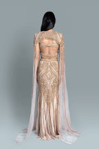 Gown with a dramatic cape and intricate embroidery in a beautiful pattern - Back