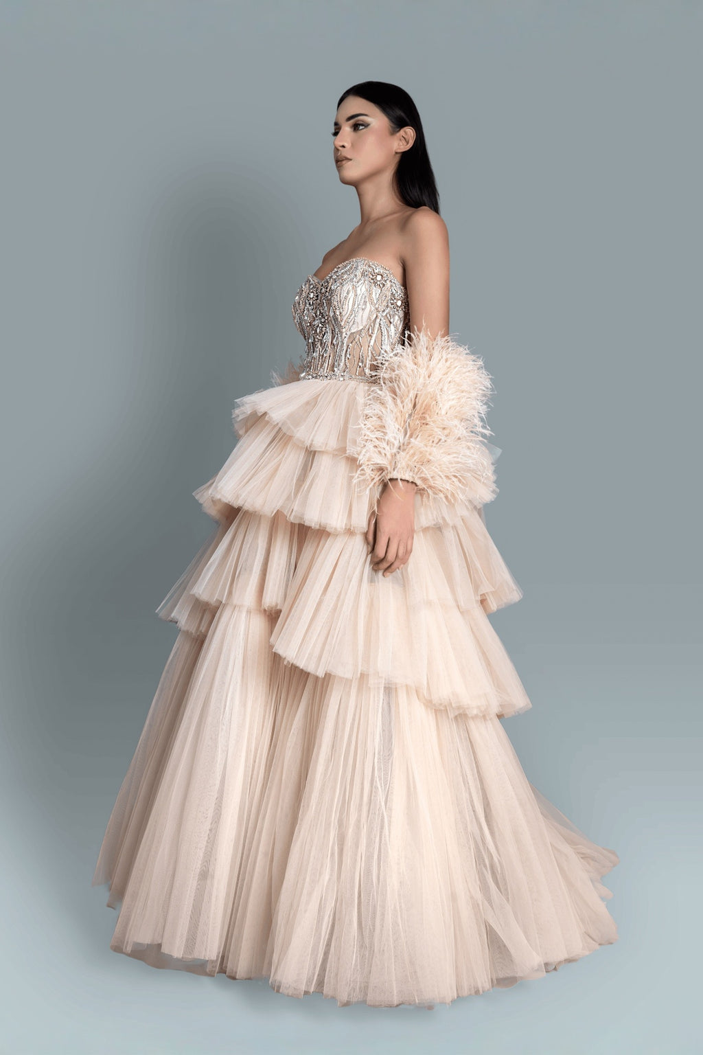 Gown with intricate embroidery with crystals and clip stones, with 4 layers of net for a high-volume fantasy gown - Side