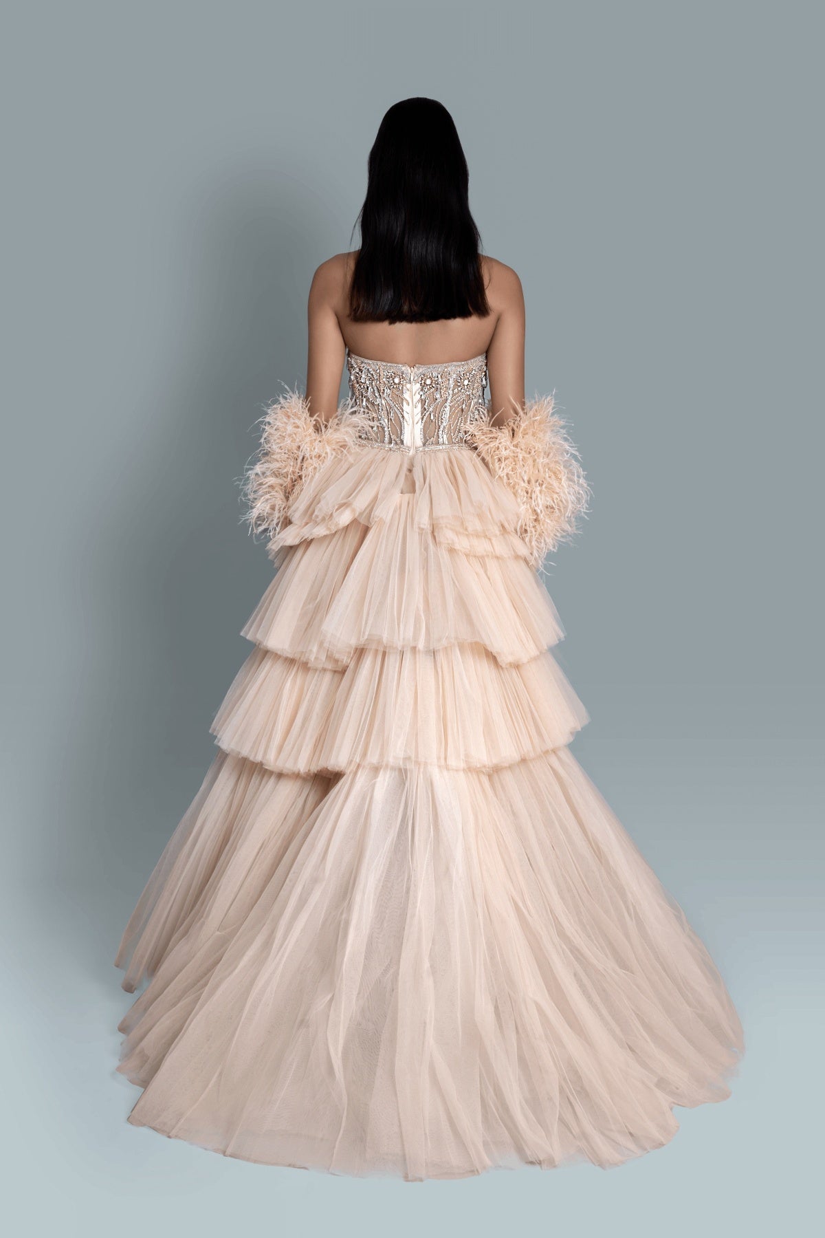 Gown with intricate embroidery with crystals and clip stones, with 4 layers of net for a high-volume fantasy gown - Back